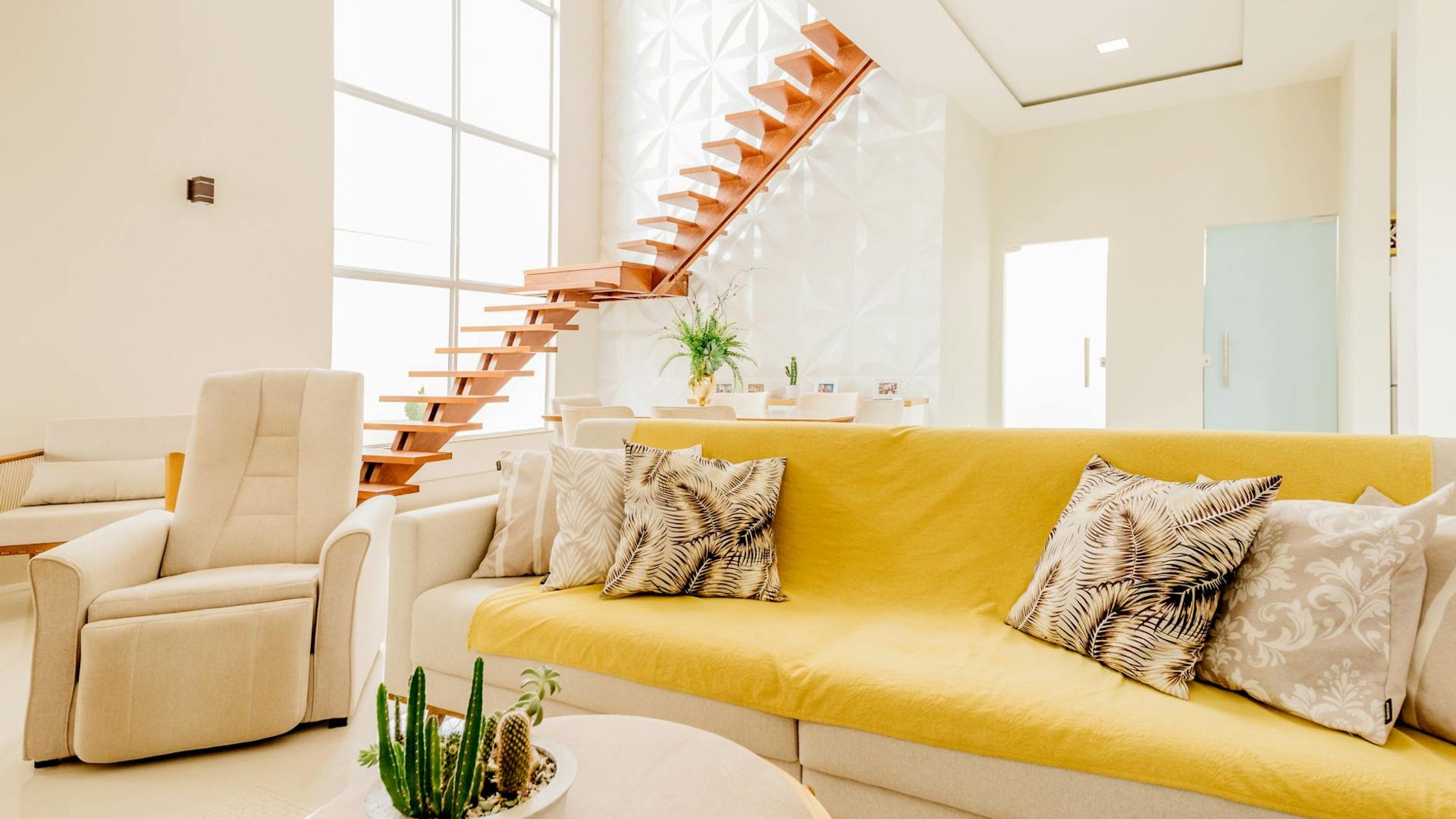 A calm and spacious empty room with soft natural light.